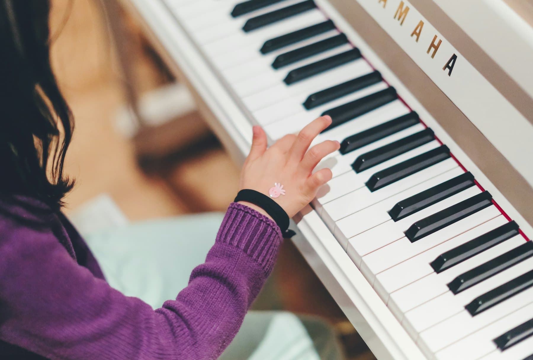 A pianist playing at a grand piano